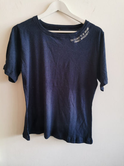The navy Too Clumsy to be Around Fragile Masculinity tee on a hanger