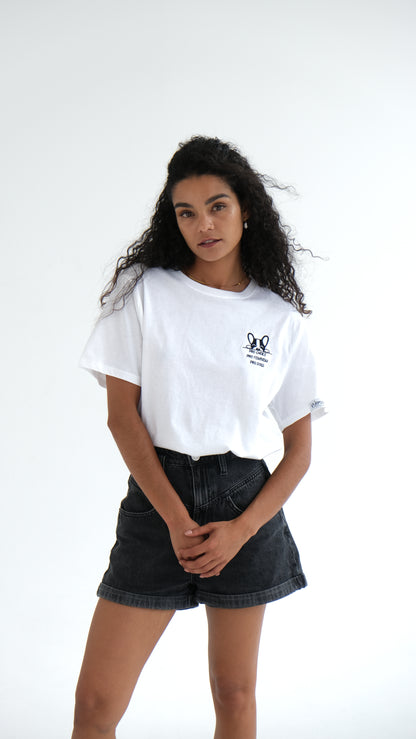 Woman in the white Pro Choice, Pro Feminism, Pro Dogs tee and black denim shorts
